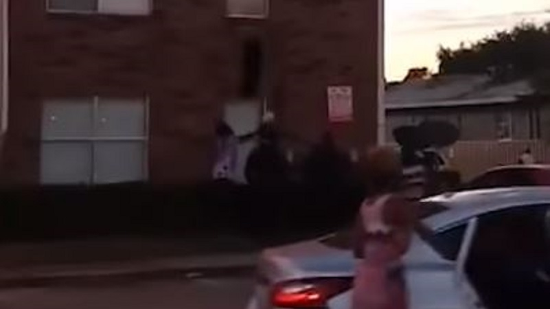 Byron Campbell catches a baby tossed from a third-floor window during an apartment fire in Dallas, TX, on Wednesday, Nov. 21, 2018.
