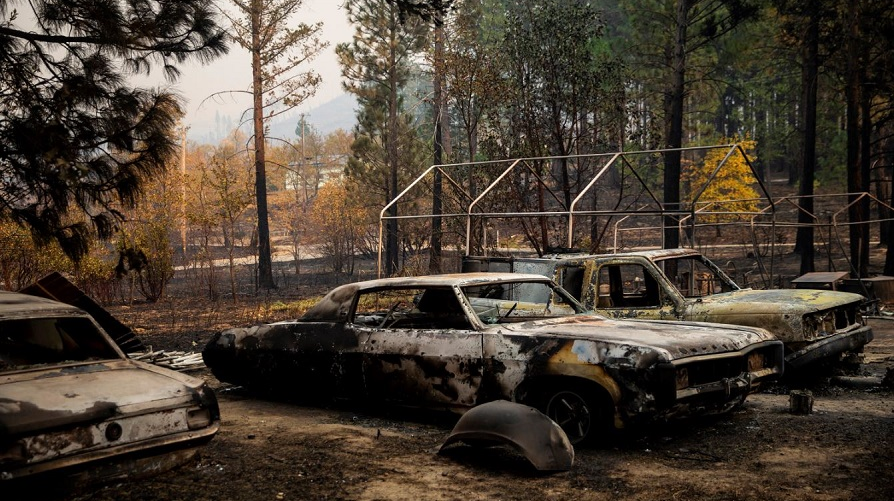 Cars destroyed by the Camp Fire outside a home along Yana Trail on Friday, Nov. 16, 2018, in Concow, CA.