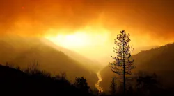 Smoke fills the sky as the Camp Fire continues to burn along the North Fork of the Feather River in Butte County, CA, on Sunday, Nov. 11, 2018.