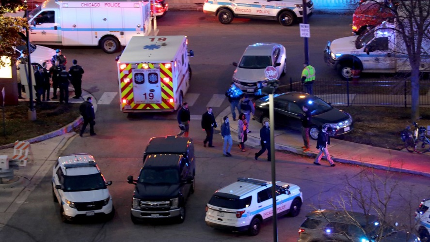 Police and fire personnel work near Mercy Hospital on Nov. 19, 2018, after four people were killed, including a Chicago police officer, in a shooting at the Near South Side hospital.