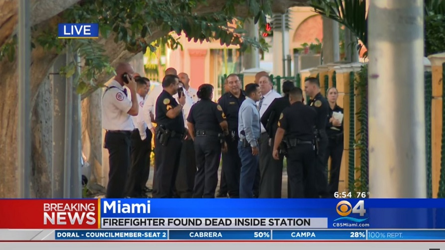 Firefighters gather after a colleague was found dead at Station 14 in Miami, FL, on Wednesday, Nov. 7, 2018.