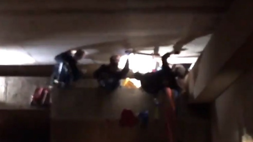Portland firefighters free a man who got stuck in a 12-inch space between two structures on Wednesday, Nov. 21, 2018.