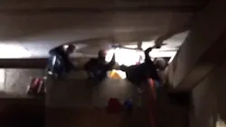 Portland firefighters free a man who got stuck in a 12-inch space between two structures on Wednesday, Nov. 21, 2018.