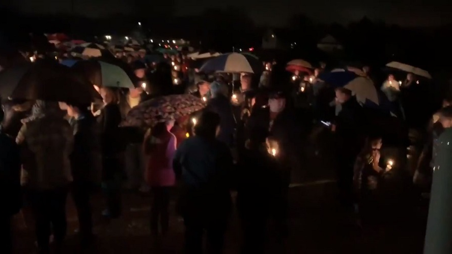 A candlelight vigil is held at Halmstad Elementary School in Chippewa Falls, WI, on Sunday, Nov. 4, 2018 after Girl Scouts and a parent were killed by a pickup driver a day earlier.