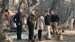 President Donald Trump, second from right, tours the Camp Fire devastation in Paradise, CA, on Saturday, Nov. 17, 2018, with, from left, Gov.-elect Gavin Newsom, Gov. Jerry Brown and Paradise Mayor Jody Jones.
