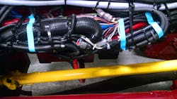 During final inspection, this wiring harness was found to lack proper securement, relying upon plastic wire ties to hold the bundle in place. During final inspection, this wiring harness was found to lack proper securement, relying upon plastic wire ties to hold the bundle in place.