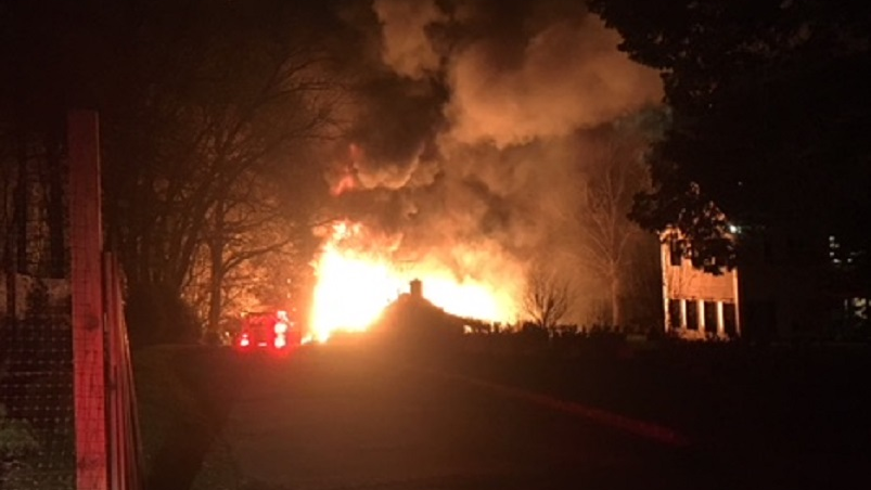 Fairfield firefighters rescued a man after a chicken coop barn fire spread to his home early Tuesday.