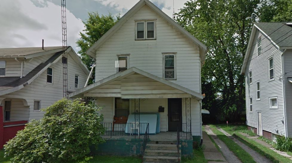 The home at 1626 Olive Place NE in Canton, OH, where a neighbor used a ladder to rescue a woman and child from the porch roof after a fire broke out on Sunday, Dec. 2, 2018.