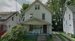 The home at 1626 Olive Place NE in Canton, OH, where a neighbor used a ladder to rescue a woman and child from the porch roof after a fire broke out on Sunday, Dec. 2, 2018.