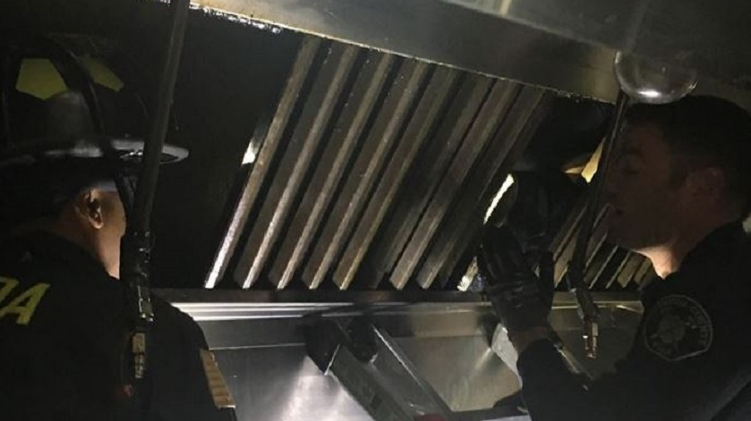 Alameda County firefighters in action on Wednesday, Dec. 12, 2018, as they work to free to a man who became trapped in the duct system above a restaurant kitchen for two days.