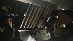 Alameda County firefighters in action on Wednesday, Dec. 12, 2018, as they work to free to a man who became trapped in the duct system above a restaurant kitchen for two days.