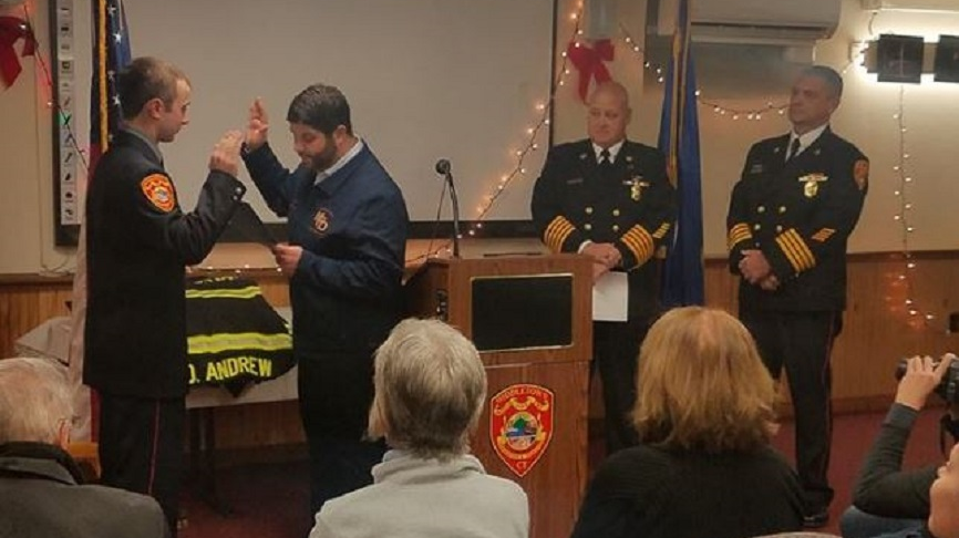 Middletown probationary firefighter Owen Andrew, left, is officially sworn in on Monday. Dec. 10, 2018.