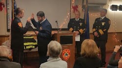 Middletown probationary firefighter Owen Andrew, left, is officially sworn in on Monday. Dec. 10, 2018.