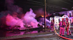New Orleans firefighters on scene during an early morning third-alarm house fire on Wednesday, Dec. 5, 2018.