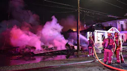 New Orleans firefighters on scene during an early morning third-alarm house fire on Wednesday, Dec. 5, 2018.