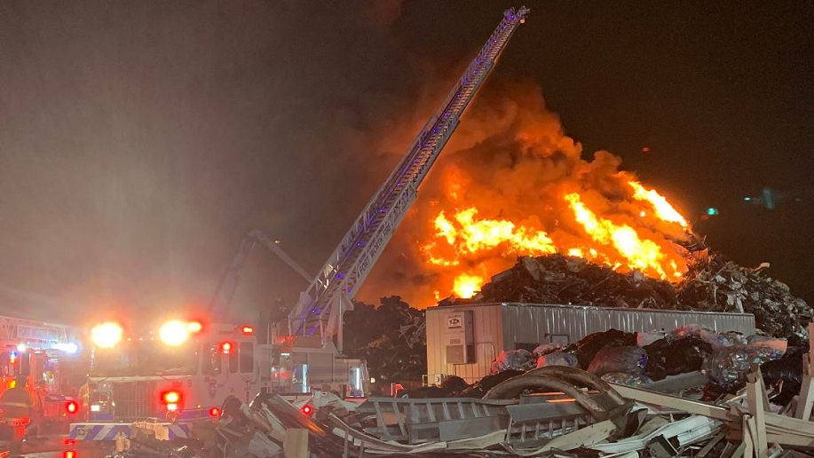 A fire burns at a scrap yard in Fort Worth, TX, on Wednesday, Dec. 26, 2018.