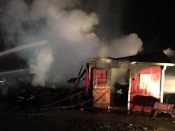 Firefighters extinguish a chicken coop barn fire that spread to a nearby home early Tuesday in Fairfield, CT. Firefighters extinguish a chicken coop barn fire that spread to a nearby home early Tuesday in Fairfield, CT.