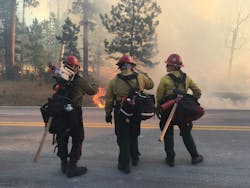Three firefighters monitor the Legion Lake Fire in December 2017. Three firefighters monitor the Legion Lake Fire in December 2017.