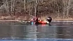 Brunswick and Topsham firefighters pulled a 54-year-old woman from the Androscoggin River on Wednesday after she jumped off a bridge.