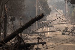 Power poles and lines block a street at Brookdale and Aaron Dr. in Hidden Valley, CA, where most of the homes were destroyed by fire in Santa Rosa on Oct. 9, 2017. Power poles and lines block a street at Brookdale and Aaron Dr. in Hidden Valley, CA, where most of the homes were destroyed by fire in Santa Rosa on Oct. 9, 2017.