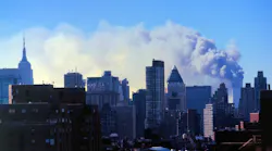 Smoke billows over New York City on September 11, 2001.