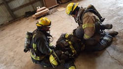 When firefighters are introduced to mayday operations during training, standard drills are performed on apparatus bay floors as simplified rescue scenarios with limited options for failure.