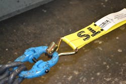 The twin hooks at both ends of the ratchet units were attached to the blue clevis links of the test machine for each destructive test. These hooks were properly loaded into the throat of the hook with the backs of the steel hooks facing downward towards the concrete floor. Photos by Ron Moore