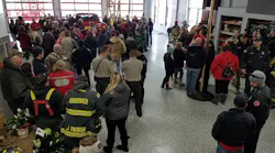 More than 100 friends and family members turned out to greet injured Clinton firefighter Adam Cain on his visit to the fire station after his release from the hospital.