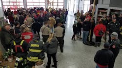 More than 100 friends and family members turned out to greet injured Clinton firefighter Adam Cain on his visit to the fire station after his release from the hospital.