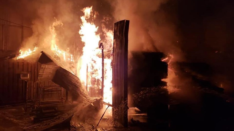 Two firefighters were hurt by a falling wall while battling a warehouse fire in Clearfield County, PA.