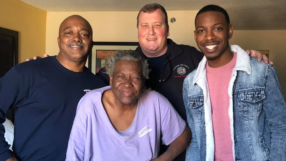 Parker District Fire Department's Chief Deputy Tom Thomas (left) and Capt. Shane Walton (center), along with South Carolina radio host QL Ellison, helped Gay Booker, who had been homeless after her house burned down in November.