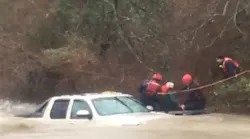 Temple firefighters rescue an elderly driver from his truck after he was swept downstream while trying to navigate a low water crossing.