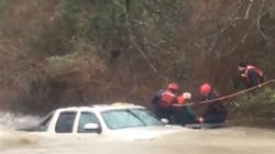 Temple firefighters rescue an elderly driver from his truck after he was swept downstream while trying to navigate a low water crossing. Temple firefighters rescue an elderly driver from his truck after he was swept downstream while trying to navigate a low water crossing.