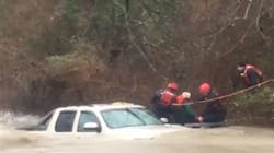 Temple firefighters rescue an elderly driver from his truck after he was swept downstream while trying to navigate a low water crossing.