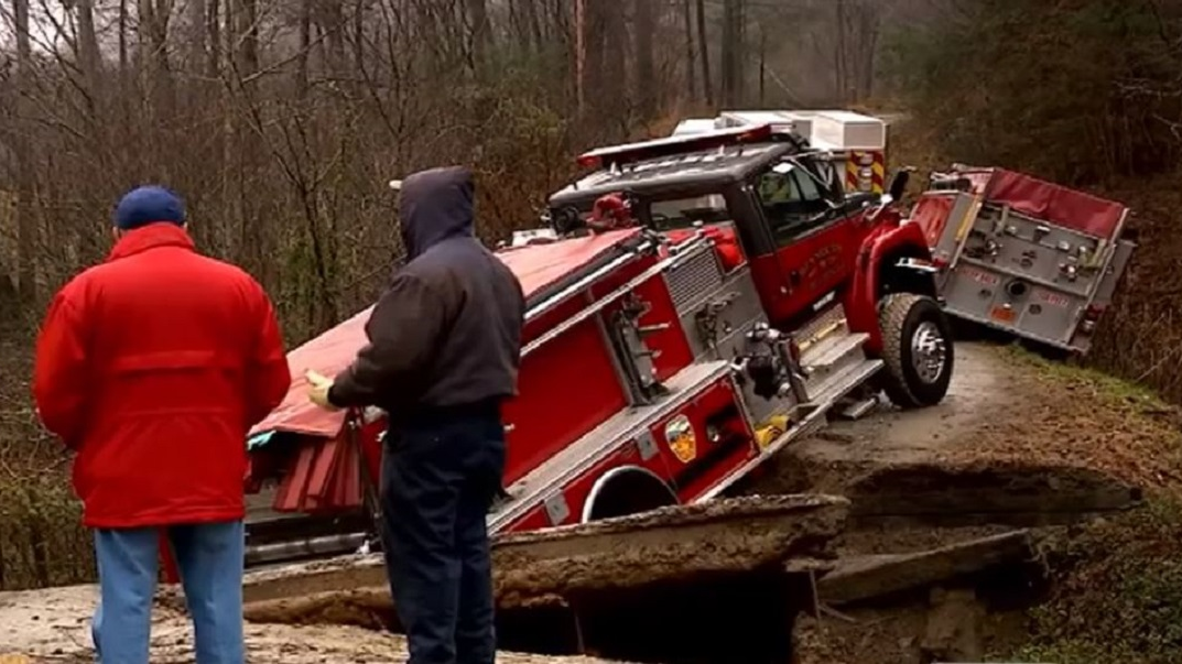 Apparatus from three different North Carolina fire departments were stranded when a private bridge collapsed as the vehicles were on their way to cabin fire over the weekend.