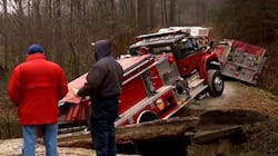 Apparatus from three different North Carolina fire departments were stranded when a private bridge collapsed as the vehicles were on their way to cabin fire over the weekend.