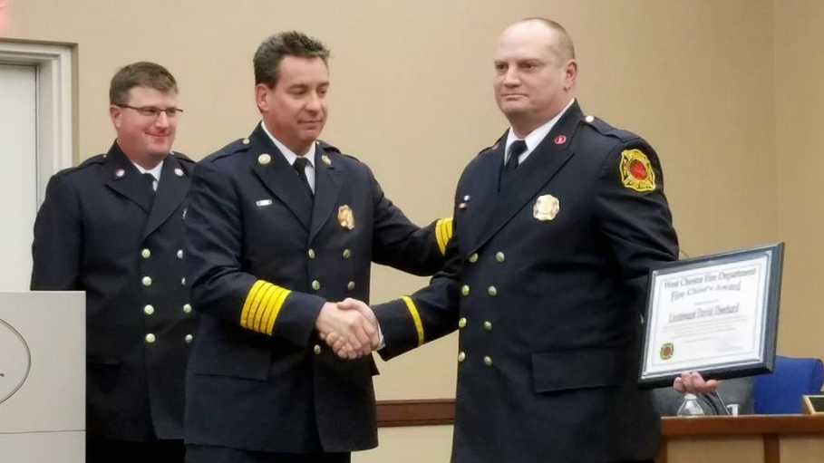 Lt. David Eberhard (right) receives the West Chester Township Fire Department's Fire Chief Award, an honor that hasn't been given out since 2007.