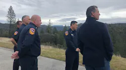California Gov. Gavin Newsom, right, tours wildfire-affected areas of the Sierra foothills with CAL FIRE personnel on Tuesday, Jan. 8, 2019.