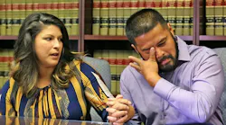 Orlando Police Officer Gerry Realin, right, wipes tears from his eyes as his wife Jessica speaks during an interview on Aug. 11, 2016, nearly two months after the Pulse nightclub shooting in Orlando, FL. Officer Realin, who was on the Hazmat team that had to remove all the bodies from the club, has dealt with PTSD and blood pressure so high he was admitted to a hospital.