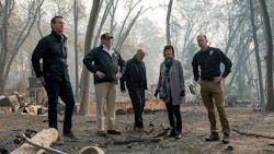 From left, Gov.-elect Gavin Newson, President Donald Trump, Gov. Jerry Brown, Paradise Mayor Jody Jones and FEMA Director Brock Long tour the Skyway Villa Mobile Home and RV Park after the devastating Camp Fire in Paradise, CA, on Nov. 17, 2018.