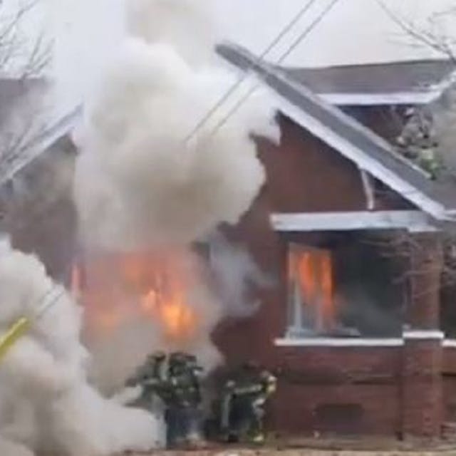 Decatur firefighters had a close call as flames erupted through an outside window as they battled a house fire.