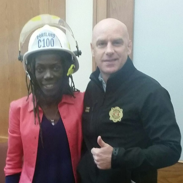 Portland, OR, Fire Chief Mike Myers poses with new Commissioner Jo Ann Hardesty at her swearing in ceremony Wednesday. Myers resigned as chief Thursday.