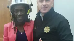 Portland, OR, Fire Chief Mike Myers poses with new Commissioner Jo Ann Hardesty at her swearing in ceremony Wednesday. Myers resigned as chief Thursday.