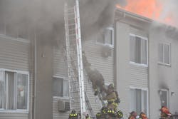 While searching for residents, two firefighters became trapped and called a mayday. One firefighter came down the ground ladder head first, and the second firefighter jumped. While searching for residents, two firefighters became trapped and called a mayday. One firefighter came down the ground ladder head first, and the second firefighter jumped.