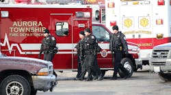Police officers armed with rifles respond to a shooting Friday afternoon at a manufacturing plant in Aurora, a suburb west of Chicago Police officers armed with rifles respond to a shooting Friday afternoon at a manufacturing plant in Aurora, a suburb west of Chicago