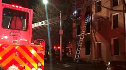 A Baltimore City firefighter escaped injury Saturday after falling through the floor while battling a fire at a three-story vacant home.