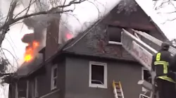 Boston firefighters battled a 'very difficult' five-alarm fire at a home in Roxbury on Tuesday.