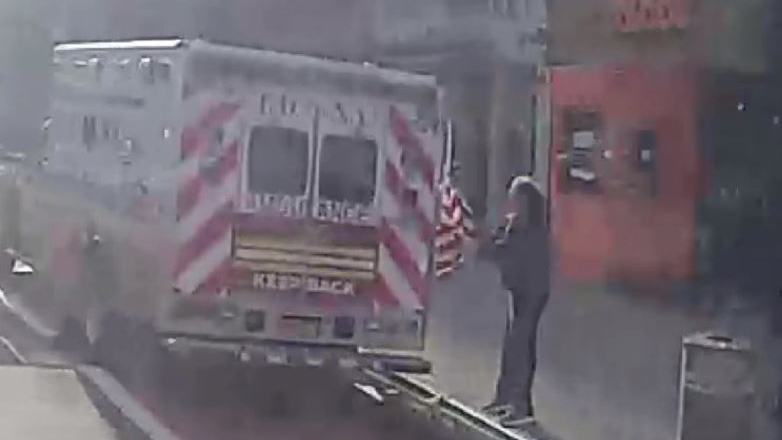 Dashboard camera footage released by the FDNY shows a man pulling an American flag from a parked ambulance on Jan. 25 in Manhattan.