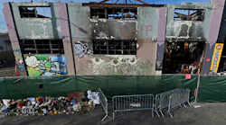 The view outside the scorched Ghost Ship warehouse building in Oakland, CA. The blaze tore through the two-story building on the 1300 block of 31st Avenue, killing 36 people.