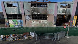 The view outside the scorched Ghost Ship warehouse building in Oakland, CA. The blaze tore through the two-story building on the 1300 block of 31st Avenue, killing 36 people.